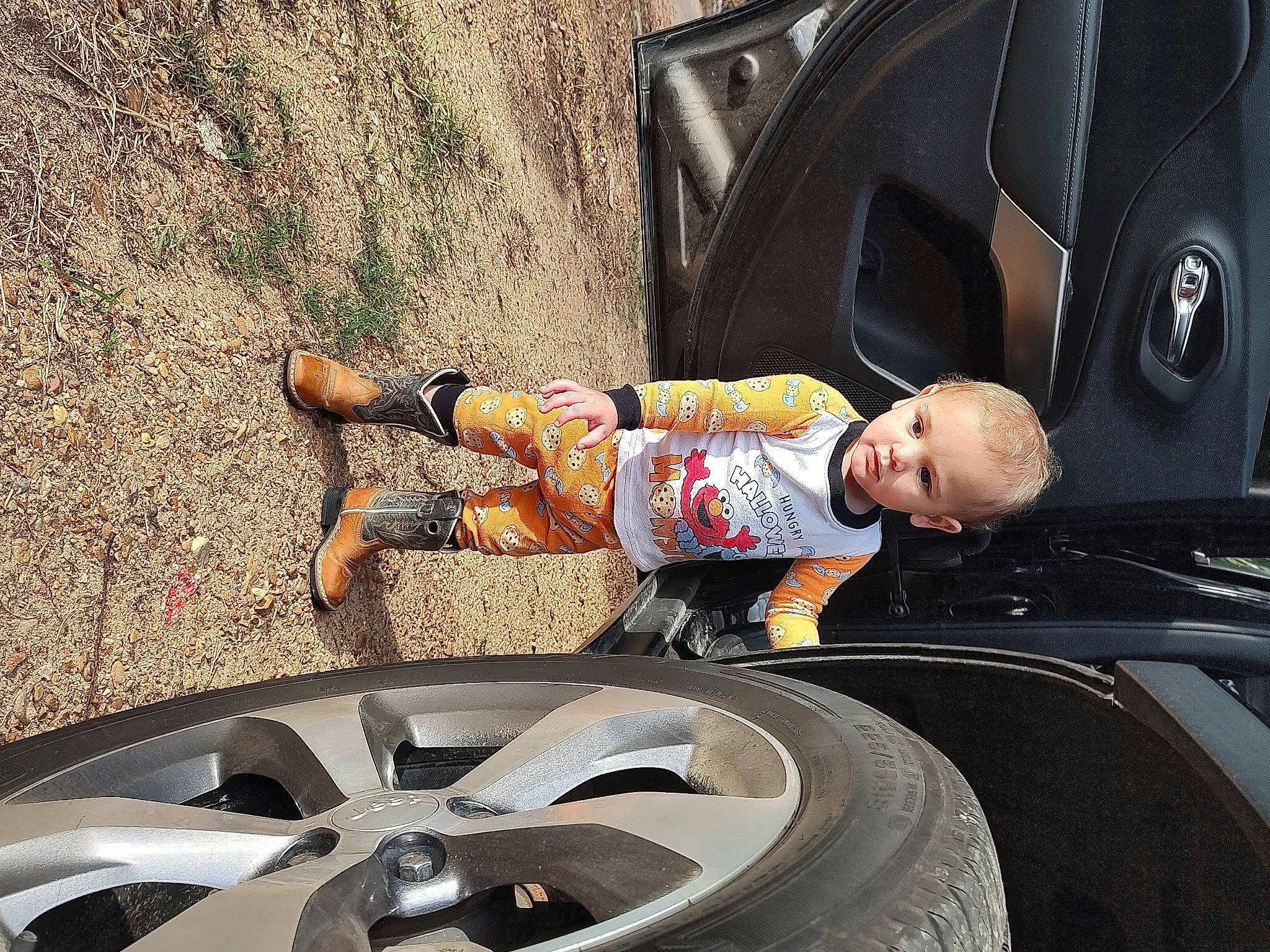 Briar joined the competition — help win amazing prizes! alloy_wheel, automotive_design, automotive_exterior, automotive_tire, black, fender, hubcap, light, mode_of_transport, motor_vehicle, person, photograph, product, rim, shorts, synthetic_rubber, tire, toddler, tread, vehicle