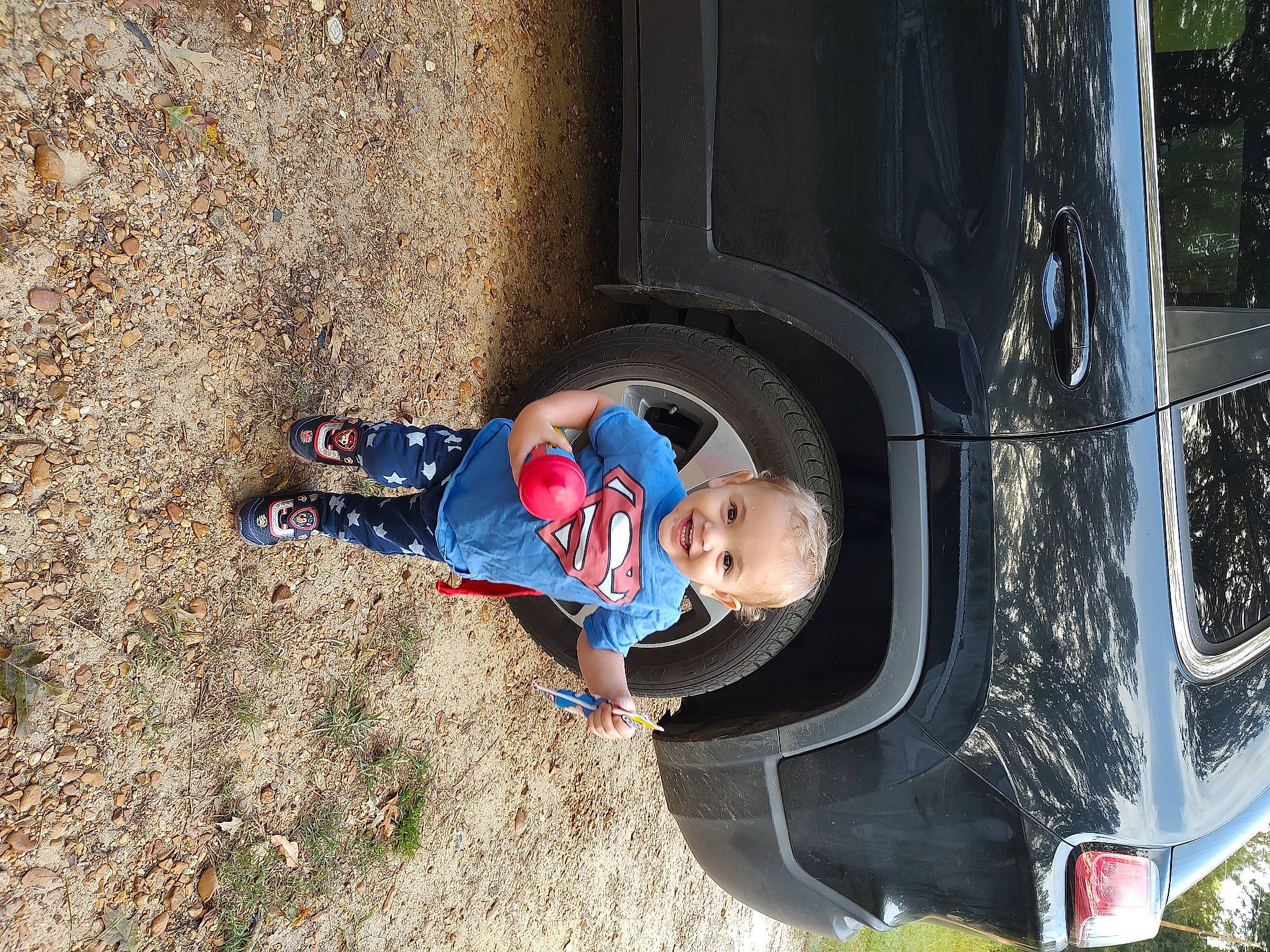 Briar joined the competition — help win amazing prizes! automotive_design, automotive_exterior, automotive_lighting, automotive_tire, automotive_wheel_system, bumper, car, electric_blue, fender, hood, joy, motor_vehicle, person, plant, smile, tire, toddler, tree, vehicle, vehicle_door