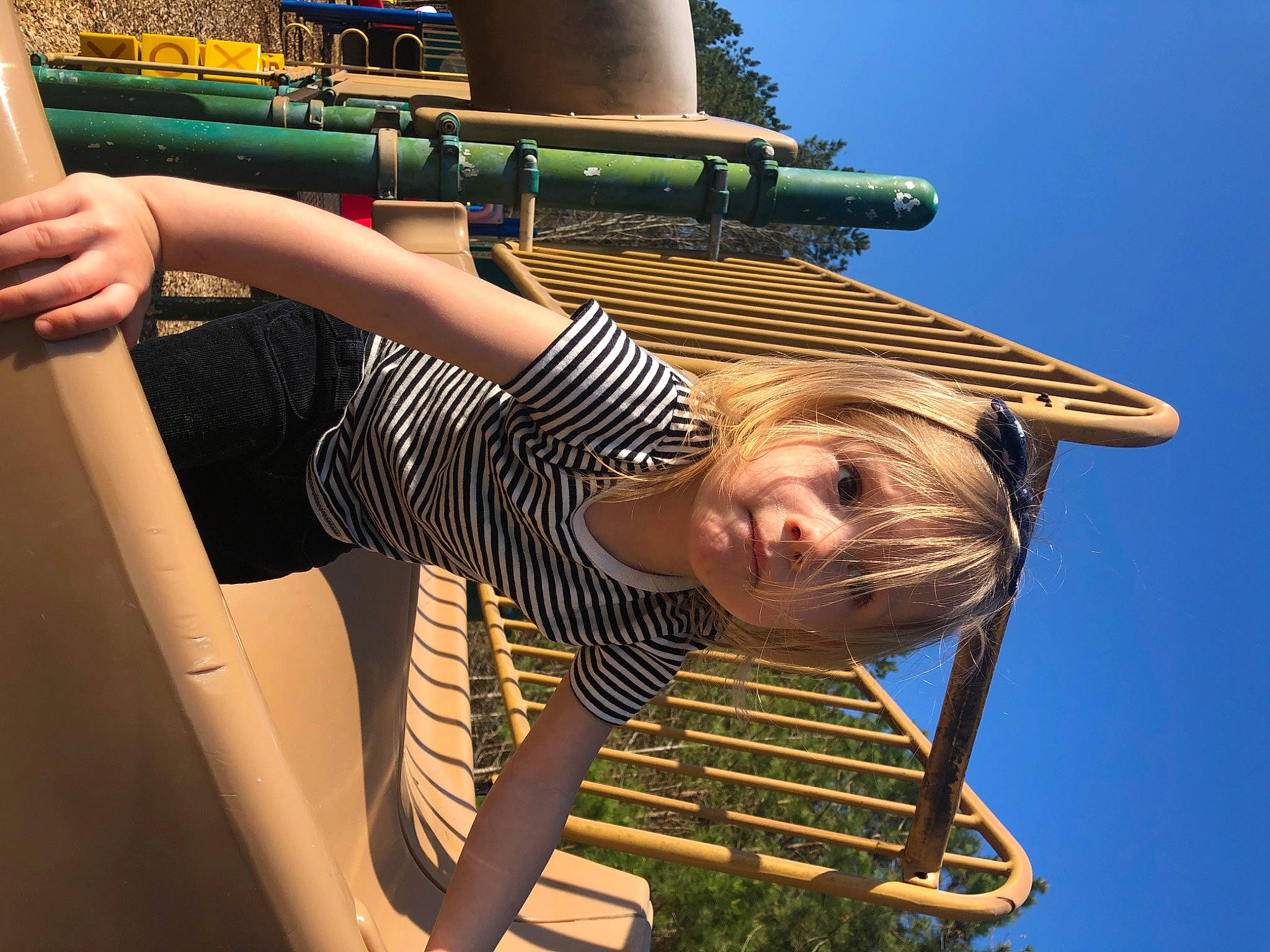 Ivy Rose joined the competition — help win amazing prizes! blond, child, cool, elbow, flash_photography, fun, happy, human_leg, leisure, outdoor_play_equipment, person, pipe, recreation, sky, smile, t_shirt, thigh, travel, tree, vacation