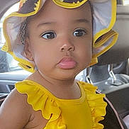 Azylahfaye joined the competition — help win amazing prizes! child, baby, toddler, yellow, sun_hat, bow, ruffles, swimsuit, floral, car_interior, car_seat, seatbelt, big_eyes, pouty_lips, portrait, close_up, adorable, headwear, summer_outfit, infant