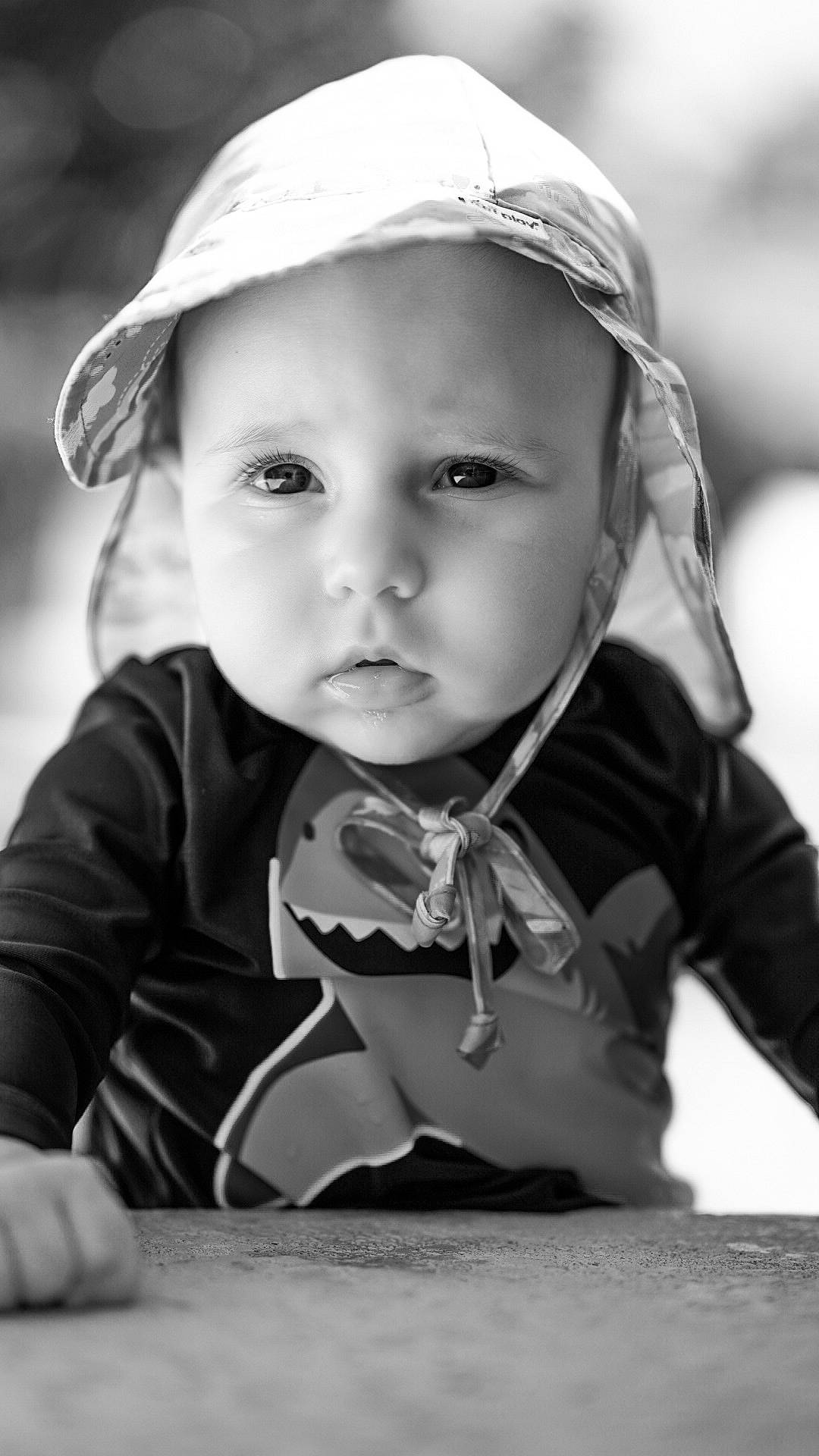 Ripley is registered to the contest to win money with this photo: baby, black, black_and_white, cheek, child, eye, face, head, headwear, lip, monochrome, monochrome_photography, people, person, photograph, photography, portrait, portrait_photography, skin, smile