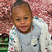 Jayden joined the competition — help win amazing prizes! child, toddler, smiling, jacket, chain, outdoor, cherry_blossoms, trees, spring, nature, face, happy, portrait, cute, clothing, green_grass, daylight, park, young, person