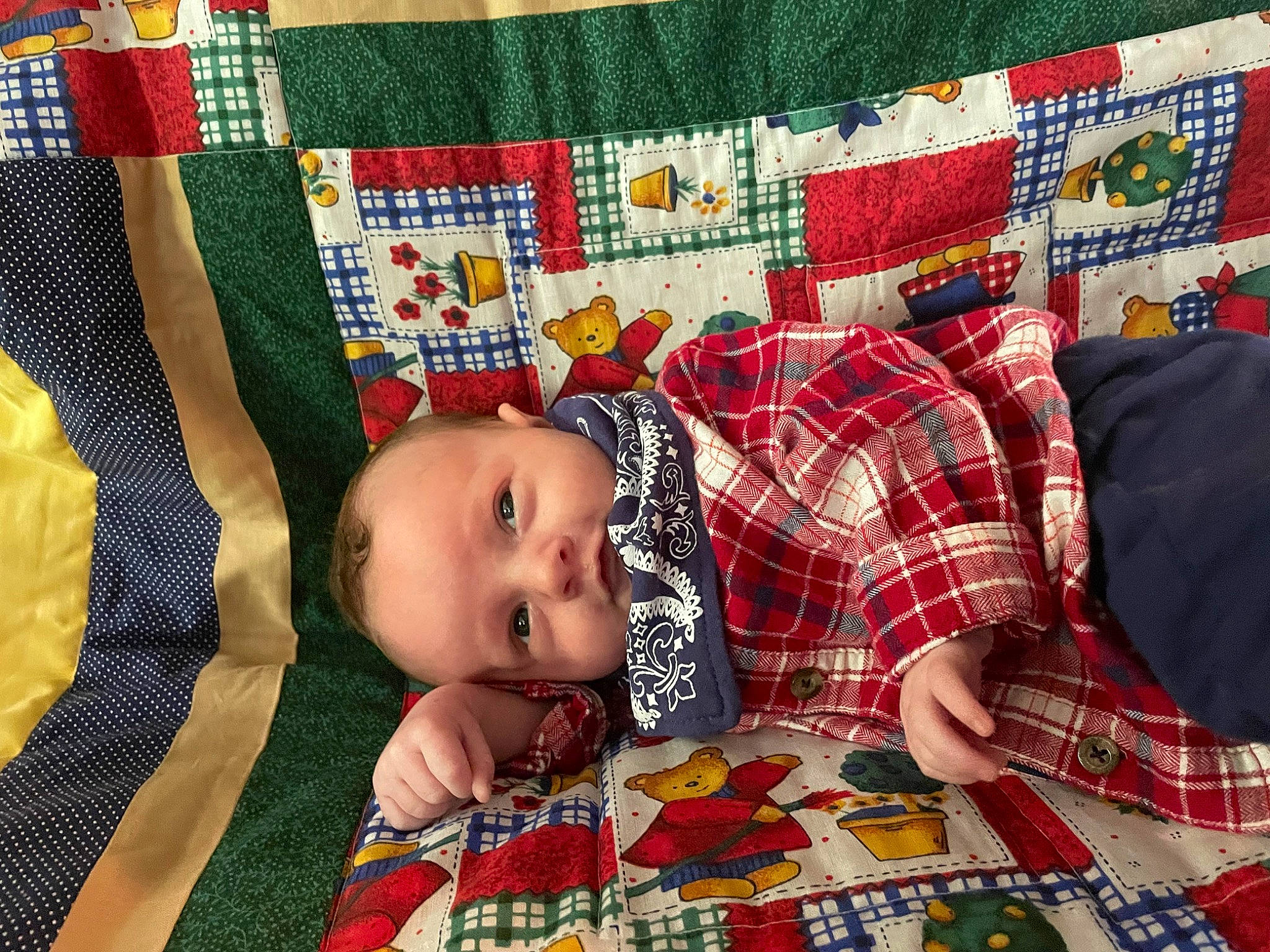 Matthew is registered to the contest to win money with this photo: art, baby, bed_sheet, bedding, child, comfort, craft, creative_arts, flooring, green, linens, pattern, person, plaid, quilt, rectangle, room, tartan, textile, toddler
