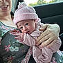 Haven is registered to the contest to win money with this photo: adult, baby, car_interior, closeup, cute, face, floral_dress, hand, holding, infant, knit_hat, nature_outside, newborn, person, pink_clothing, portrait, seatbelt, skin, warm_light, window