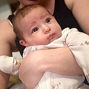 Haven is registered to the contest to win money with this photo: baby, adult, smile, pajamas, holding, closeup, face, expression, indoor, person, skin, arm, hand, cute, infant, love, comfort, parent, child, portrait