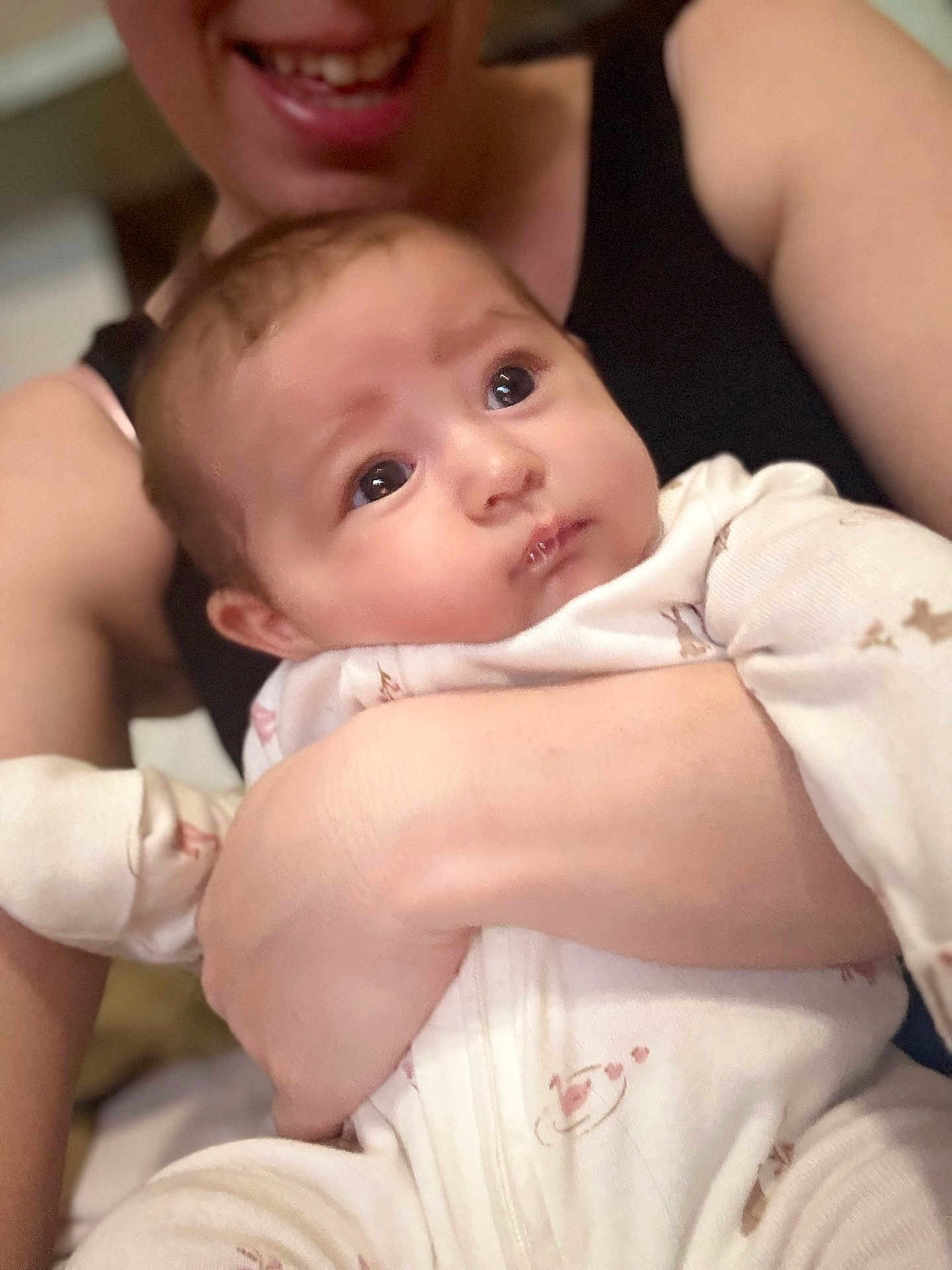 Haven is registered to the contest to win money with this photo: baby, adult, smile, pajamas, holding, closeup, face, expression, indoor, person, skin, arm, hand, cute, infant, love, comfort, parent, child, portrait