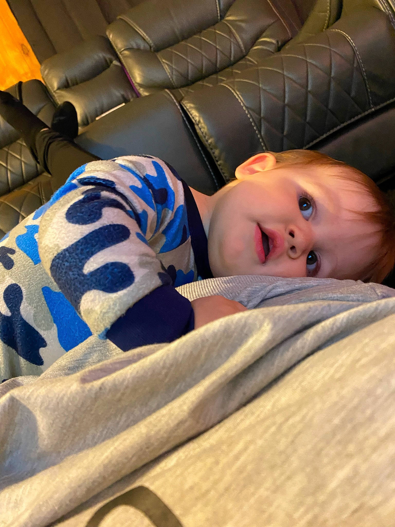 Maverick joined the competition — help win amazing prizes! baby, child, comfort, couch, electric_blue, flash_photography, flooring, human_leg, linens, nap, pattern, person, portrait_photography, room, sitting, sleep, smile, sofa_bed, studio_couch, toddler