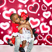 Mylah joined the competition — help win amazing prizes! child, children, boy, girl, kiss, red_bow, tutu, denim_pants, black_shoes, heart_background, sparkles, love, affection, cute, smile, studio_photo, family, siblings, toddler, happy
