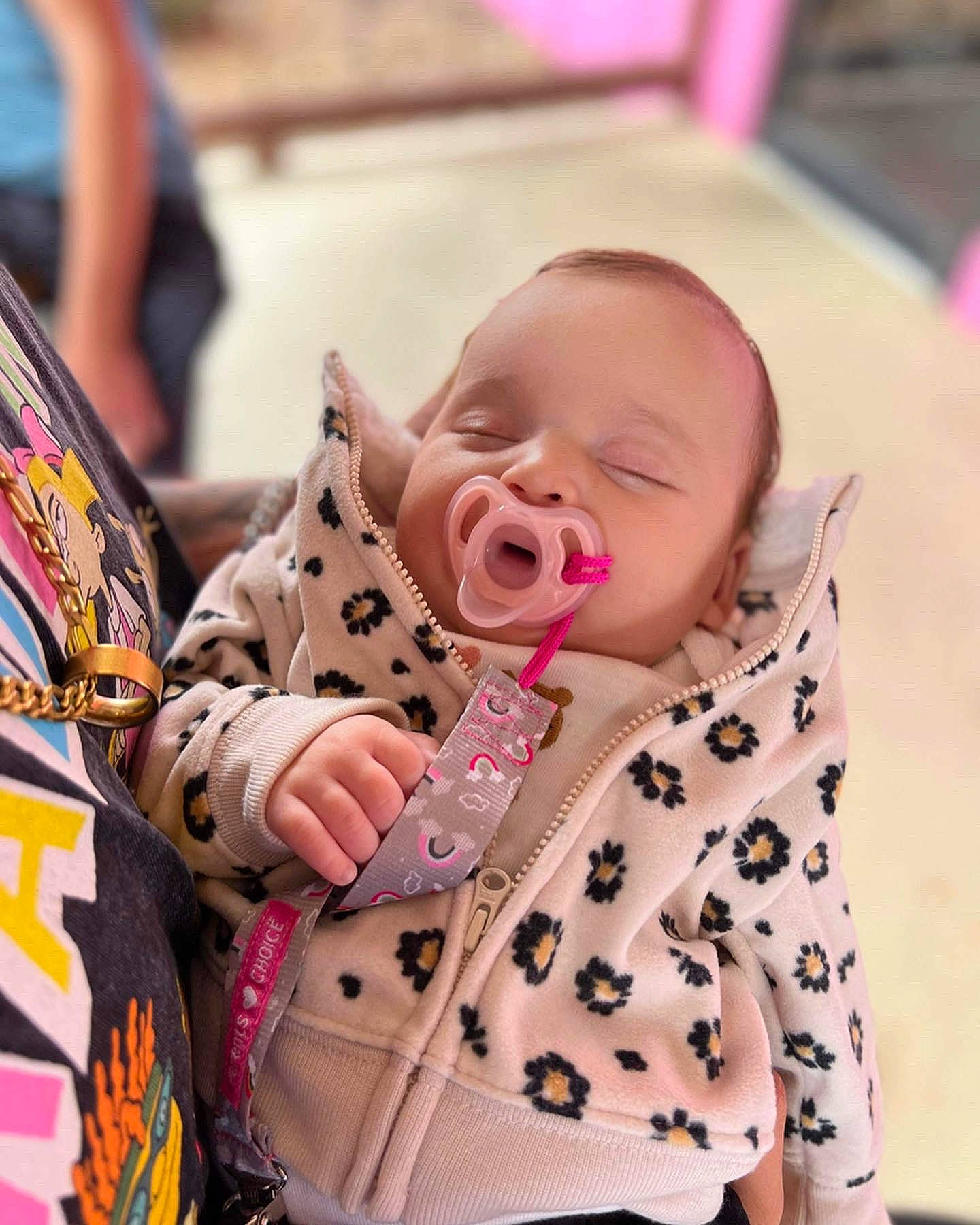 Adriana is registered to the contest to win money with this photo: baby, baby_products, baby_toddler_clothing, cheek, child, collar, comfort, facial_expression, fun, hairstyle, happy, pattern, peach, person, pink, portrait_photography, sitting, skin, sleeve, textile