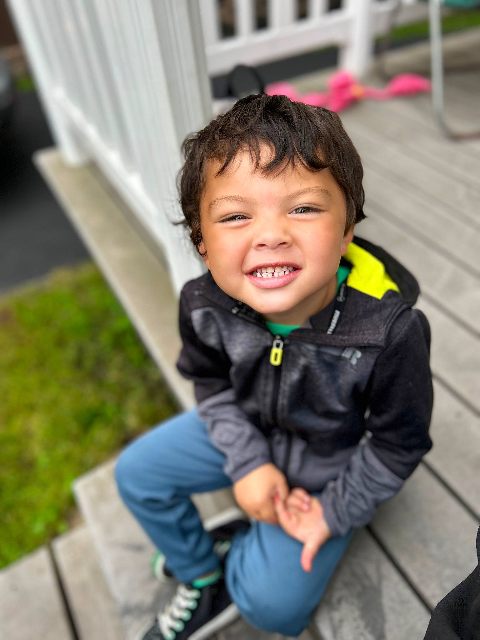 Legend is registered to the contest to win money with this photo: baby_toddler_clothing, cheek, child, curtain, denim, electric_blue, eye, fun, grass, happy, jacket, leisure, person, portrait_photography, recreation, sitting, skin, sleeve, smile, toddler