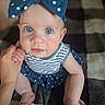 Sophia joined the competition — help win amazing prizes! baby, child, infant, blue_eyes, bow, headband, polka_dot, striped_clothing, hand_holding, blanket, checkered, cute, sitting, portrait, indoor, skin, person, young_child, adorable, closeup