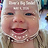 River is registered to the contest to win money with this photo: baby, smile, face, infant, doodle, text_overlay, blue_eyes, clothing, cute, portrait, indoors, child, happy, closeup, expression, skin, head, person, young, background