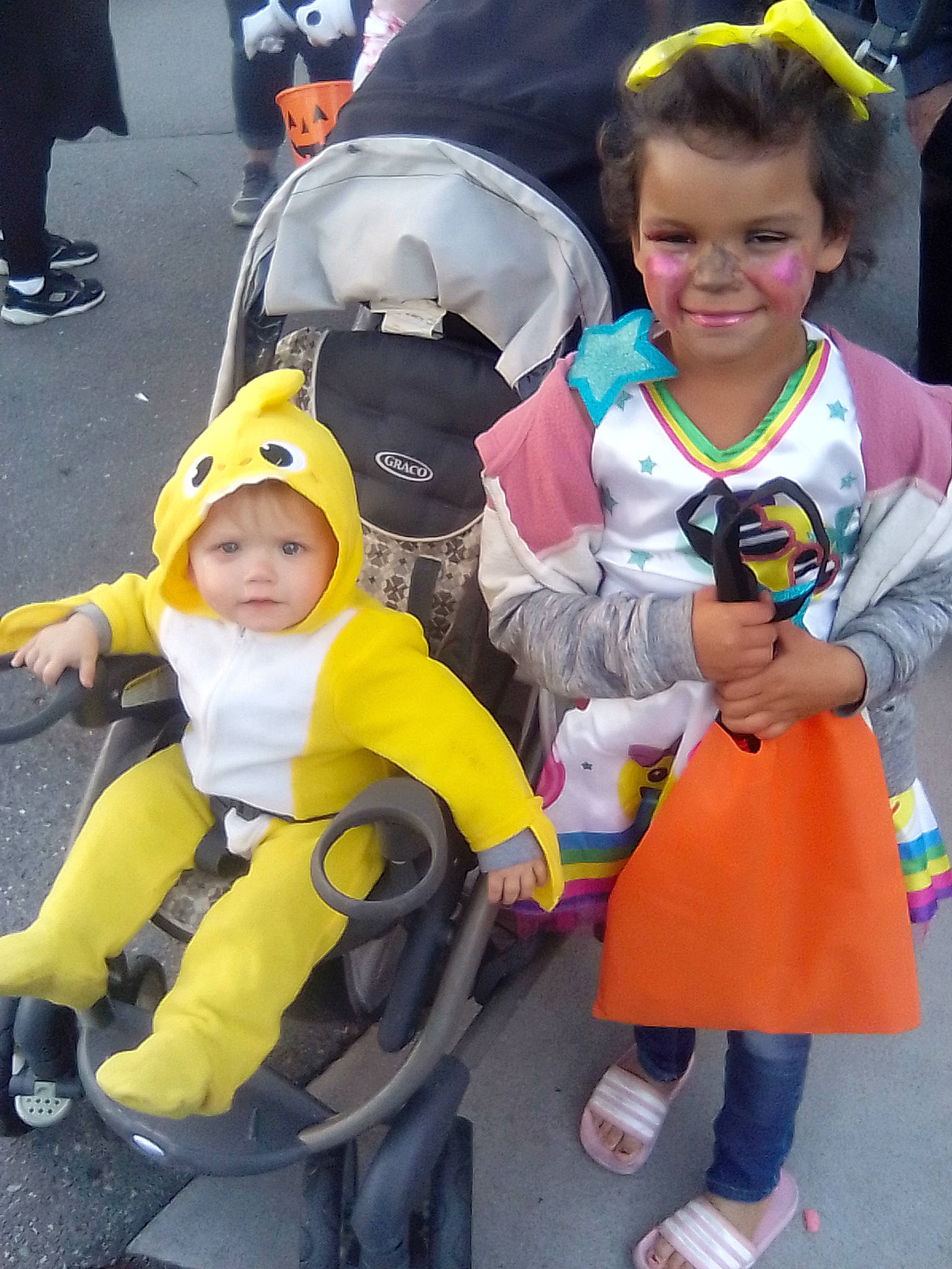 Lannessa is registered to the contest to win money with this photo: baby, baby_carriage, child, costume, event, eye, fictional_character, fun, hairstyle, happy, headwear, joy, lap, leisure, person, personal_protective_equipment, recreation, shoe, smile, sneakers
