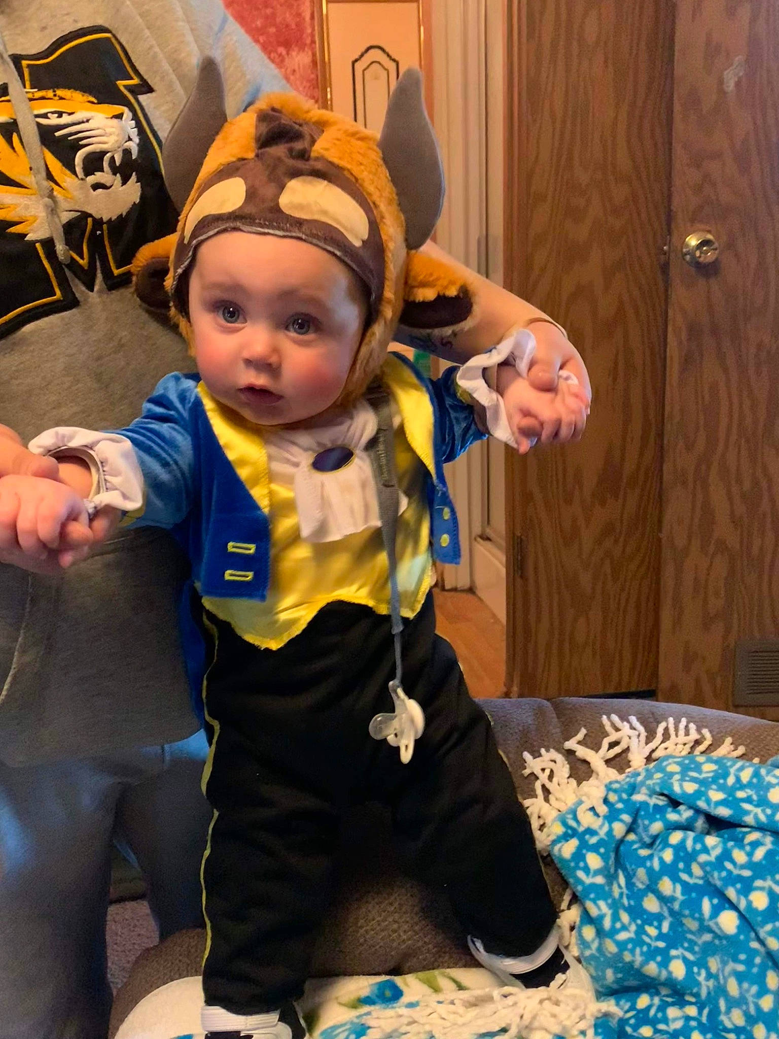 Dakota is registered to the contest to win money with this photo: animated_cartoon, animation, baby, child, cosplay, costume, curtain, electric_blue, event, fictional_character, flooring, fun, happy, headwear, leisure, mascot, person, personal_protective_equipment, purple, room