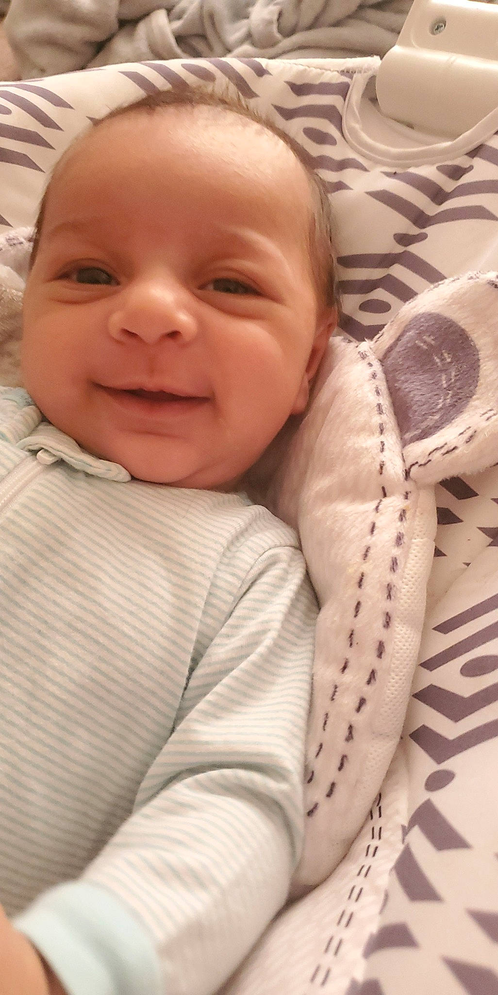 Kaleb is registered to the contest to win money with this photo: baby, baby_toddler_clothing, carmine, cheek, child, chin, comfort, eyebrow, happy, iris, joy, laugh, linens, lip, nose, pattern, person, skin, sleeve, smile