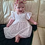 baby, baby_girl, blanket, child, comfortable, couch, cute, dress, floral_pattern, happy, headband, indoors, infant, leather, portrait, sitting, small_feet, small_hands, smile, white_dress