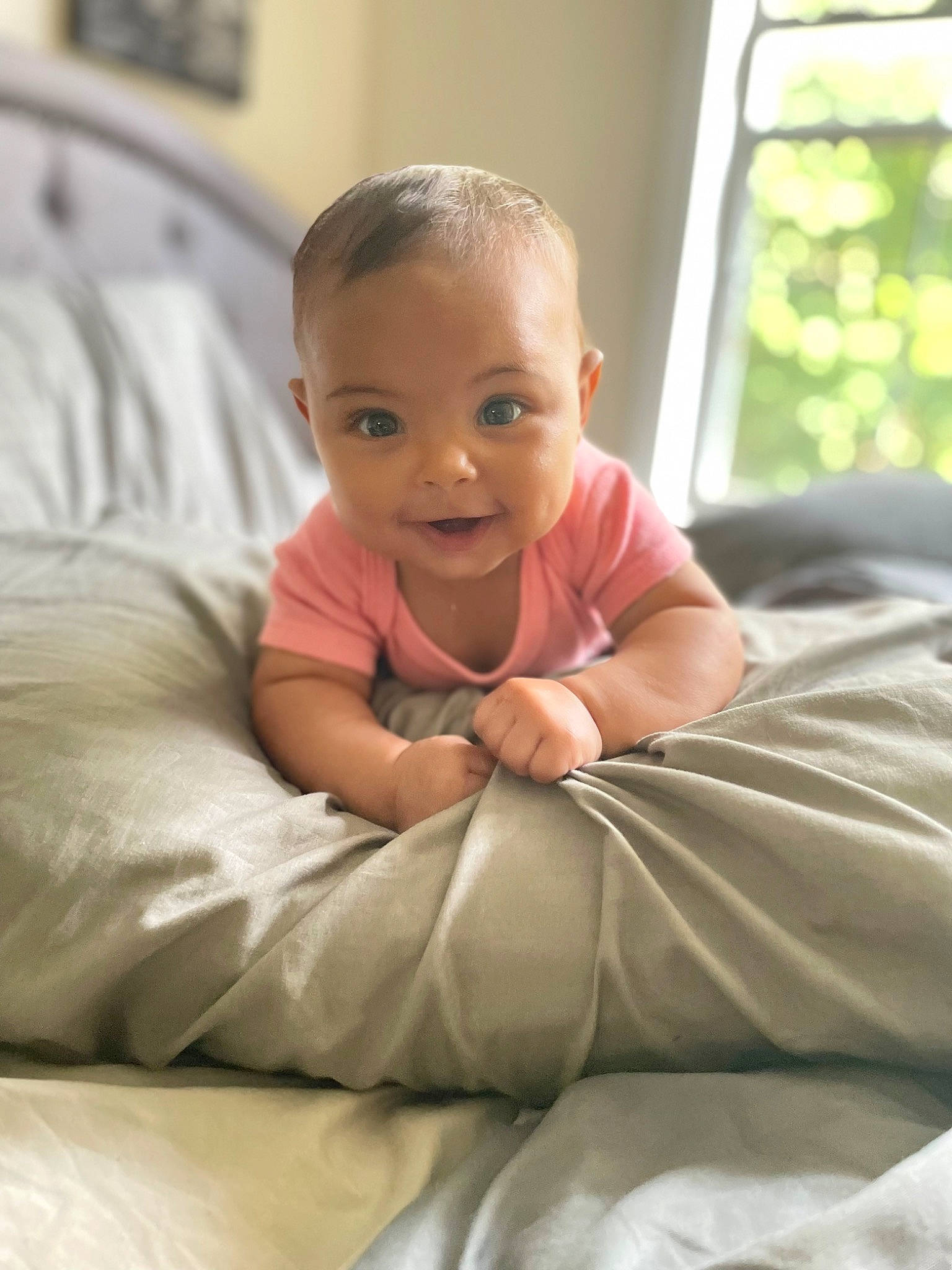 Londyn joined the competition — help win amazing prizes! baby, baby_toddler_clothing, cheek, child, comfort, couch, flooring, fun, happy, laugh, linens, living_room, person, room, sitting, skin, smile, toddler, vacation, window