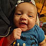 Elijah is registered to the contest to win money with this photo: baby, infant, smile, face, hand, blue_shirt, person, indoor, closeup, cute, child, portrait, skin, human, clothing, fist, happy, young, toddler, expression