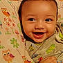 Elijah is registered to the contest to win money with this photo: baby, bedtime, blanket, child, closeup, clothing, colorful, comfort, cute, face, hand, happy, infant, owl_pattern, pattern, portrait, smiling, soft, warm, young