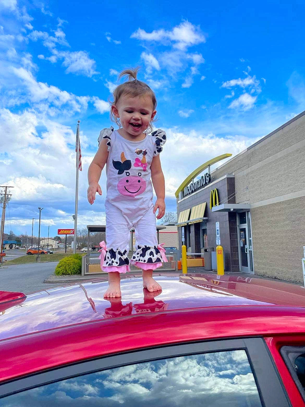 Karlee is registered to the contest to win money with this photo: asphalt, automotive_design, automotive_exterior, automotive_lighting, blue, bumper, car, cloud, electric_blue, hood, leisure, motor_vehicle, person, pink, plant, sky, toddler, tree, vehicle, vehicle_door