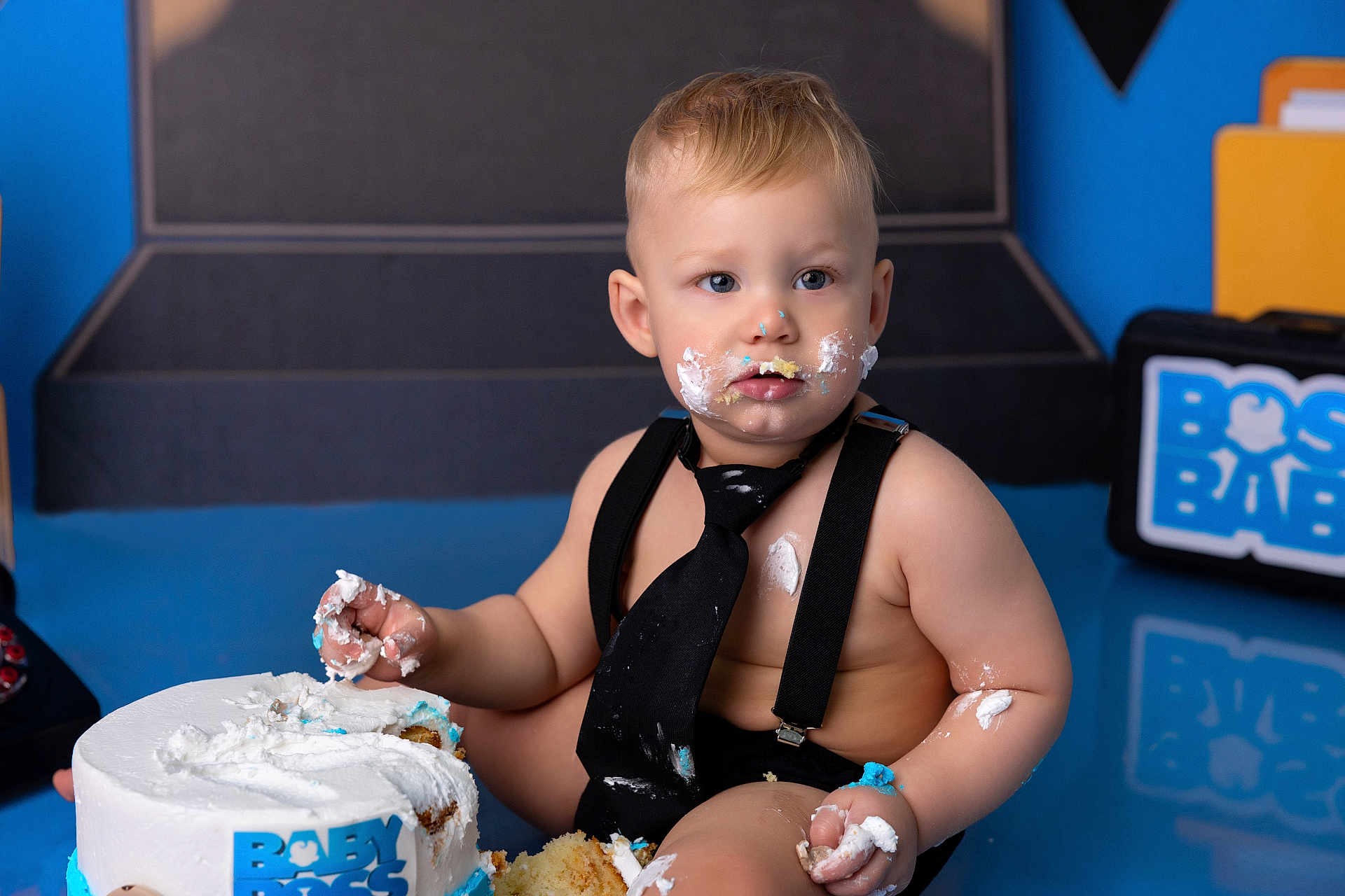 Kerem joined the competition — help win amazing prizes! baby, cake, cake_smash, frosting, messy, tie, suspenders, blue, white, face, hands, crumbs, birthday, celebration, child, indoor, photography, cute, smash, party
