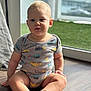 Kerem joined the competition — help win amazing prizes! baby, child, onesie, plush_toy, floor, window, natural_light, indoor, sitting, cute, toddler, toy, wooden_floor, blond_hair, face, feet, smile, casual_clothing, home, relaxing