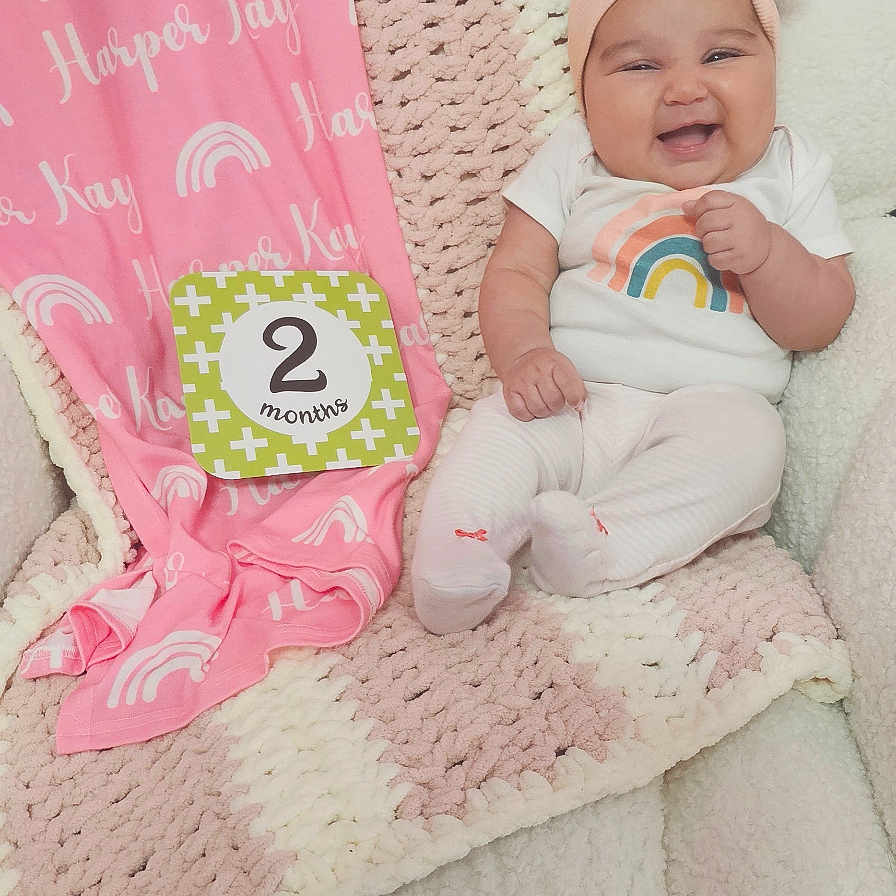 Harper joined the competition — help win amazing prizes! baby, bed, blanket, bonnet, clothing, crib, cushion, face, furniture, hat, head, homedecor, infantbed, newborn, person, photography, portrait, quilt, sitting, sleeping