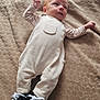 Noah a rejoint le concours — aidez-le/la à gagner de superbes lots ! baby, infant, blanket, clothing, footwear, sneakers, striped_sleeves, cute, lying_down, texture, beige, soft, newborn, person, child, indoors, apparel, small_shoes, portrait, relaxed
