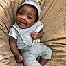 Azaiah joined the competition — help win amazing prizes! baby, smiling, infant, child, cute, happy, face, clothing, hat, blanket, sitting, portrait, skin, hand, foot, cozy, soft, texture, indoors, relaxing