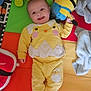 Timéo a rejoint le concours — aidez-le/la à gagner de superbes lots ! baby, infant, smile, yellow_outfit, chick_design, plush_toy, minion_toy, playmat, colorful, blanket, soft_toy, happy, portrait, lying_down, toy, clothing, hand, foot, eyes, cheek