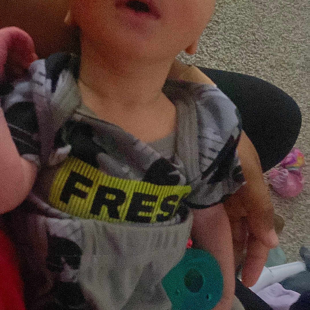 Tony Ray Jr is registered to the contest to win money with this photo: accessories, baby, bodypart, clothing, couch, cushion, face, finger, furniture, hand, head, homedecor, newborn, pants, person, photography, portrait, sleeping, t_shirt, toy