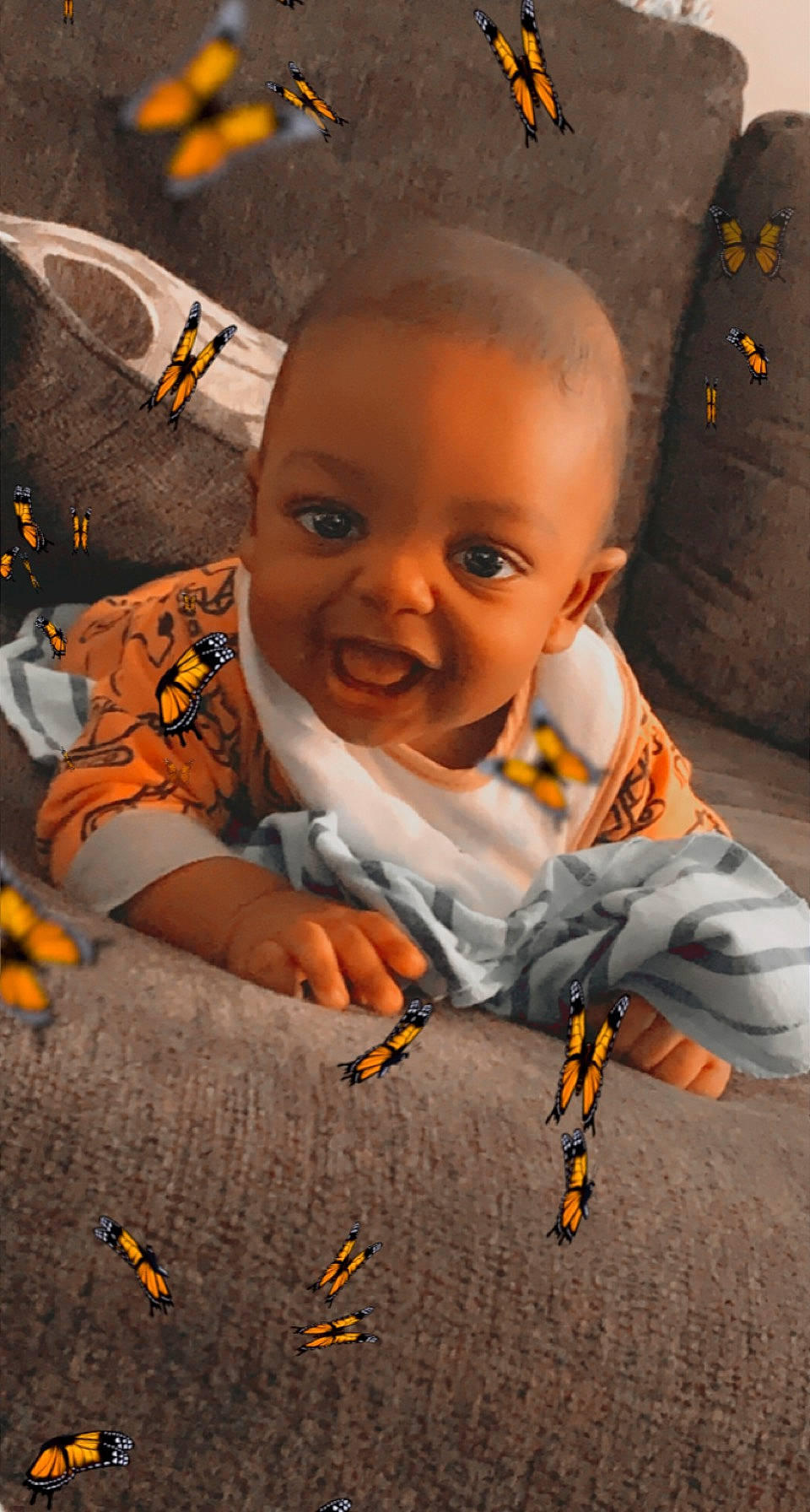 Tahj joined the competition — help win amazing prizes! adaptation, baby, cheek, child, cool, flooring, fun, happy, head, iris, joy, mouth, nose, orange, person, play, sitting, smile, t_shirt, toddler