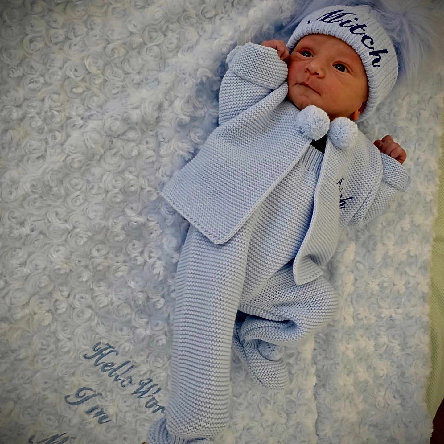 Mitch joined the competition — help win amazing prizes! baby, bed, blanket, bonnet, cap, clothing, crib, face, furniture, glove, hat, head, infantbed, newborn, person, photography, portrait, quilt, sleeping, towel