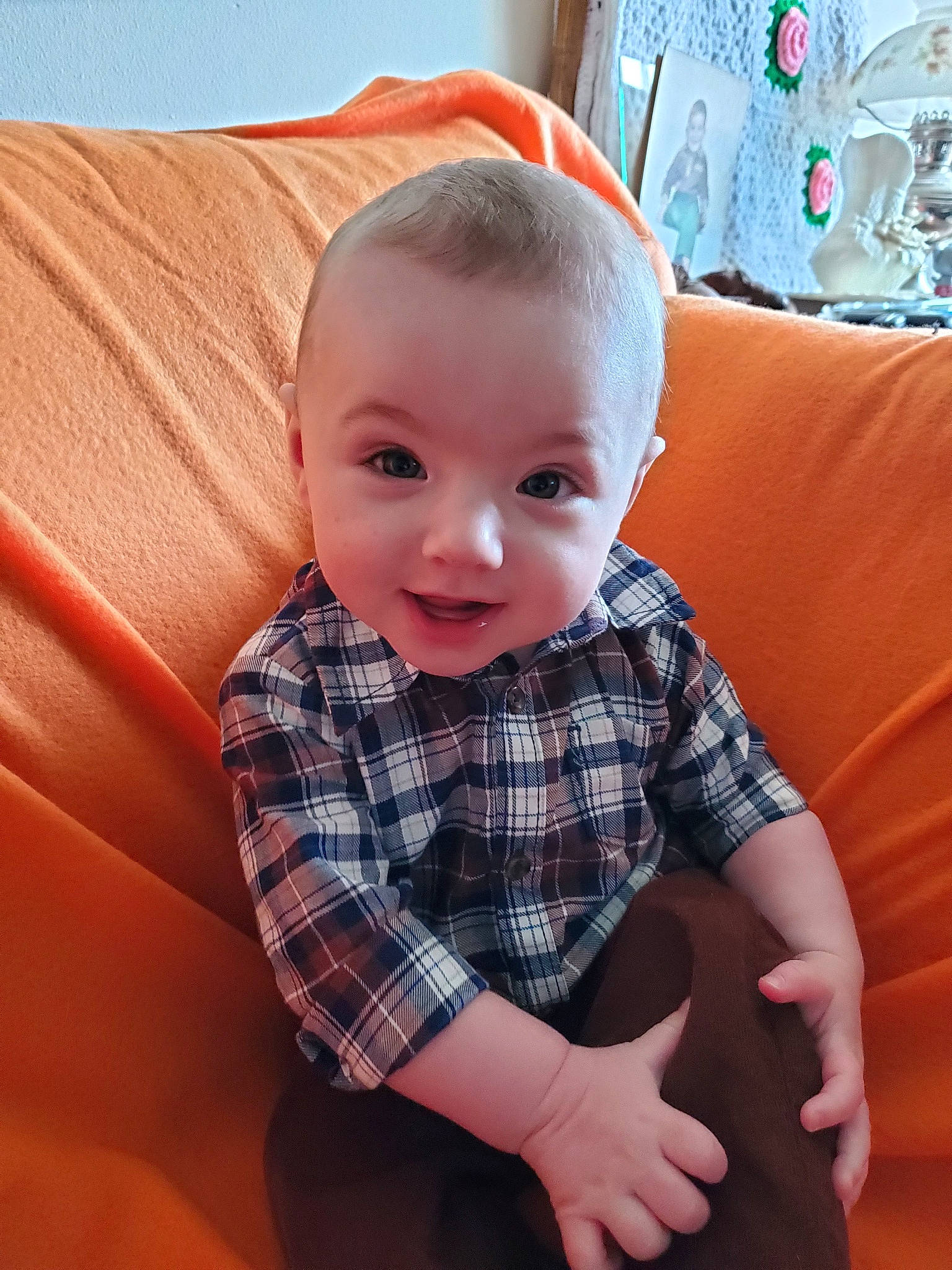 Ezrah is registered to the contest to win money with this photo: baby, cheek, child, design, eye, face, head, lip, nose, pattern, person, plaid, skin, smile, tartan, textile, toddler