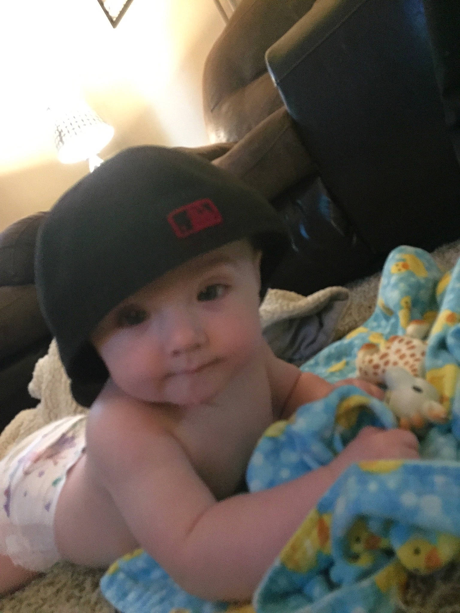 Ezrah is registered to the contest to win money with this photo: baby, beauty, cap, cheek, child, ear, electronic_device, eye, happy, hat, head, headgear, iris, person, sitting, skin, sky, smile, snapshot, toddler