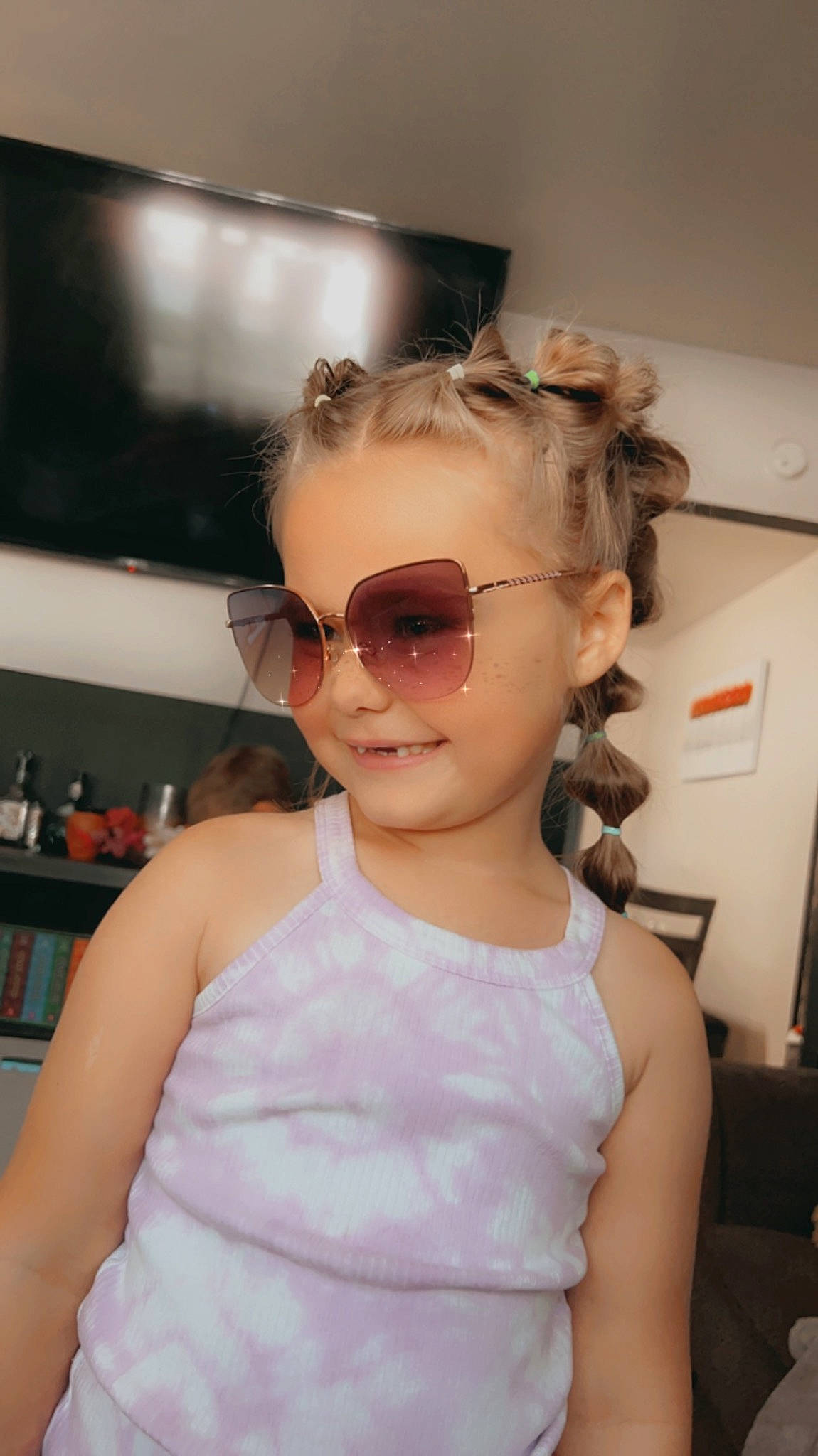 Davina joined the competition — help win amazing prizes! baby_toddler_clothing, blond, child, eyewear, fashion_accessory, fashion_design, flooring, fun, glasses, goggles, happy, joy, neck, person, personal_protective_equipment, shoulder, sleeve, smile, sunglasses, t_shirt