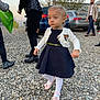 Zeliha is registered to the contest to win money with this photo: adults, background, car, cardigan, child, daylight, dress, footwear, man, nature, outdoor, people, person, rocky_path, scenery, street, toddler, trees, walking, woman