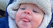 Bobby joined the competition — help win amazing prizes! baby, blue, car, child, clothing, coat, cold_weather, cute, expression, face, fleece, hood, infant, jacket, outdoor, person, skin, tongue, white, window