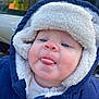 baby, blue, car, child, clothing, coat, cold_weather, cute, expression, face, fleece, hood, infant, jacket, outdoor, person, skin, tongue, white, window