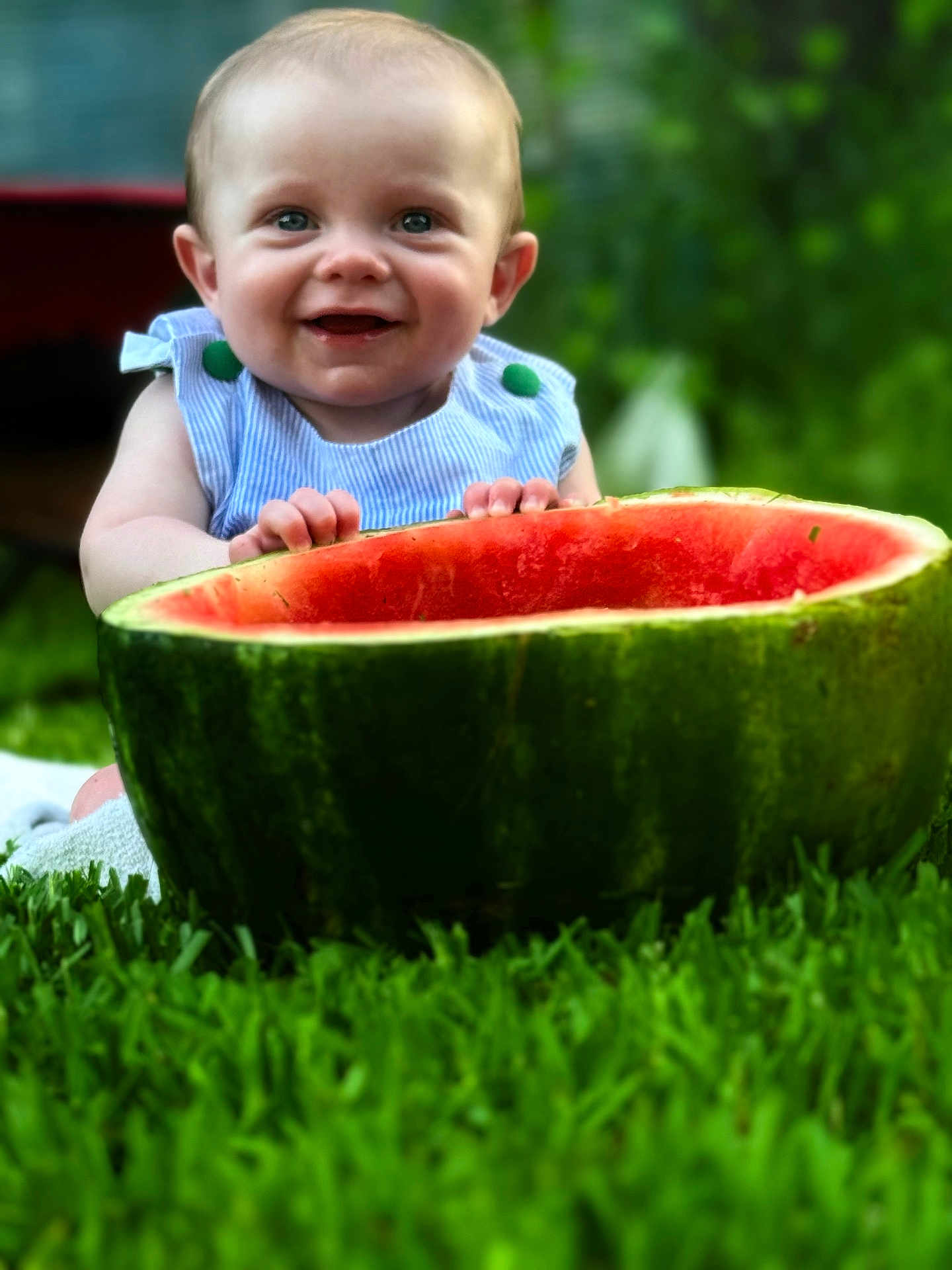 Asher is registered to the contest to win money with this photo: baby, child, watermelon, fruit, grass, outdoor, smiling, happy, nature, green, summer, cute, fresh, playful, portrait, skin, person, head, hands, blue_clothing