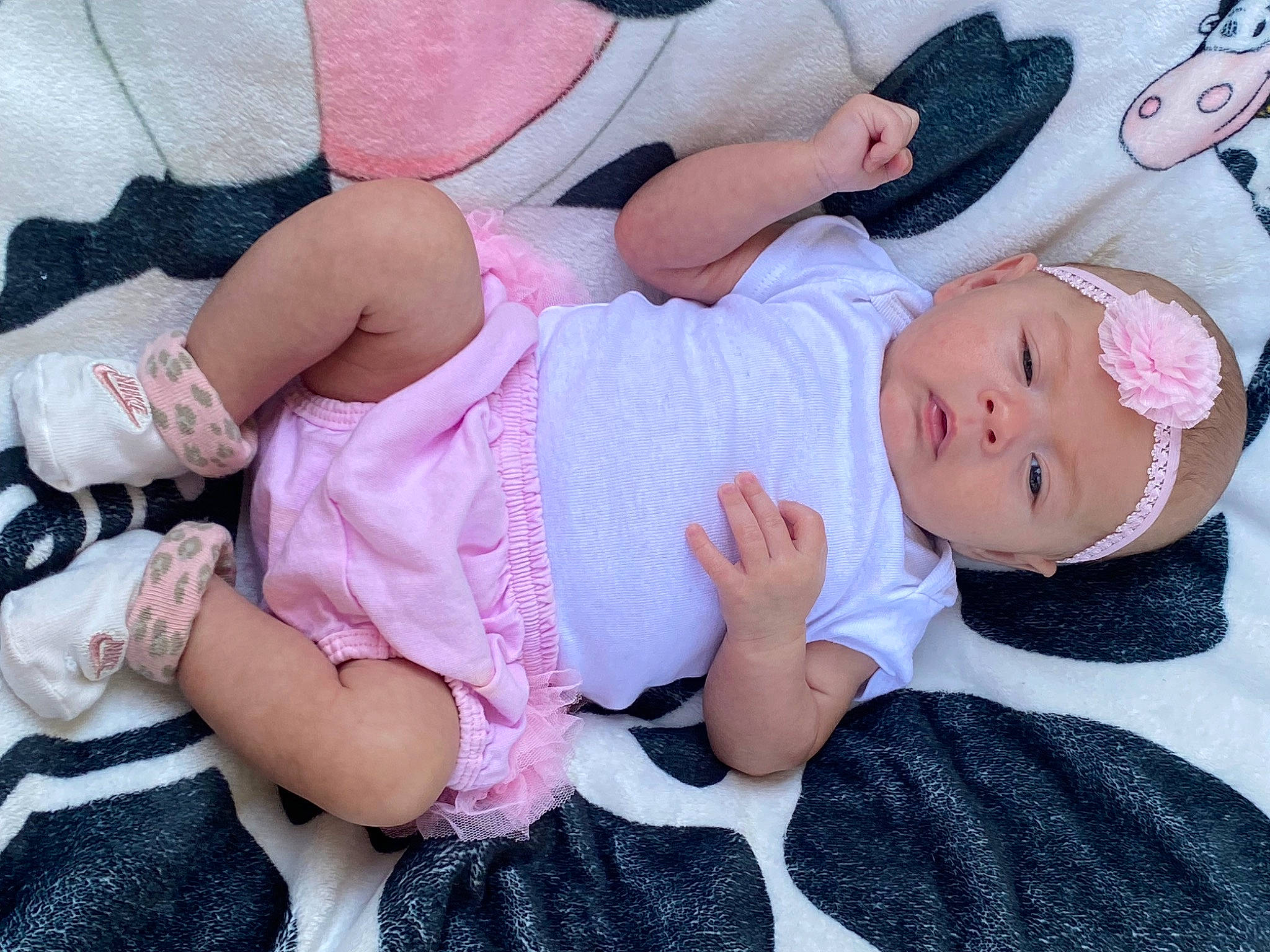 Adalynn is registered to the contest to win money with this photo: baby, baby_toddler_clothing, cheek, child, comfort, finger, happy, hat, headgear, headwear, human_body, human_leg, lap, pattern, person, pink, skin, sleeve, sock, textile