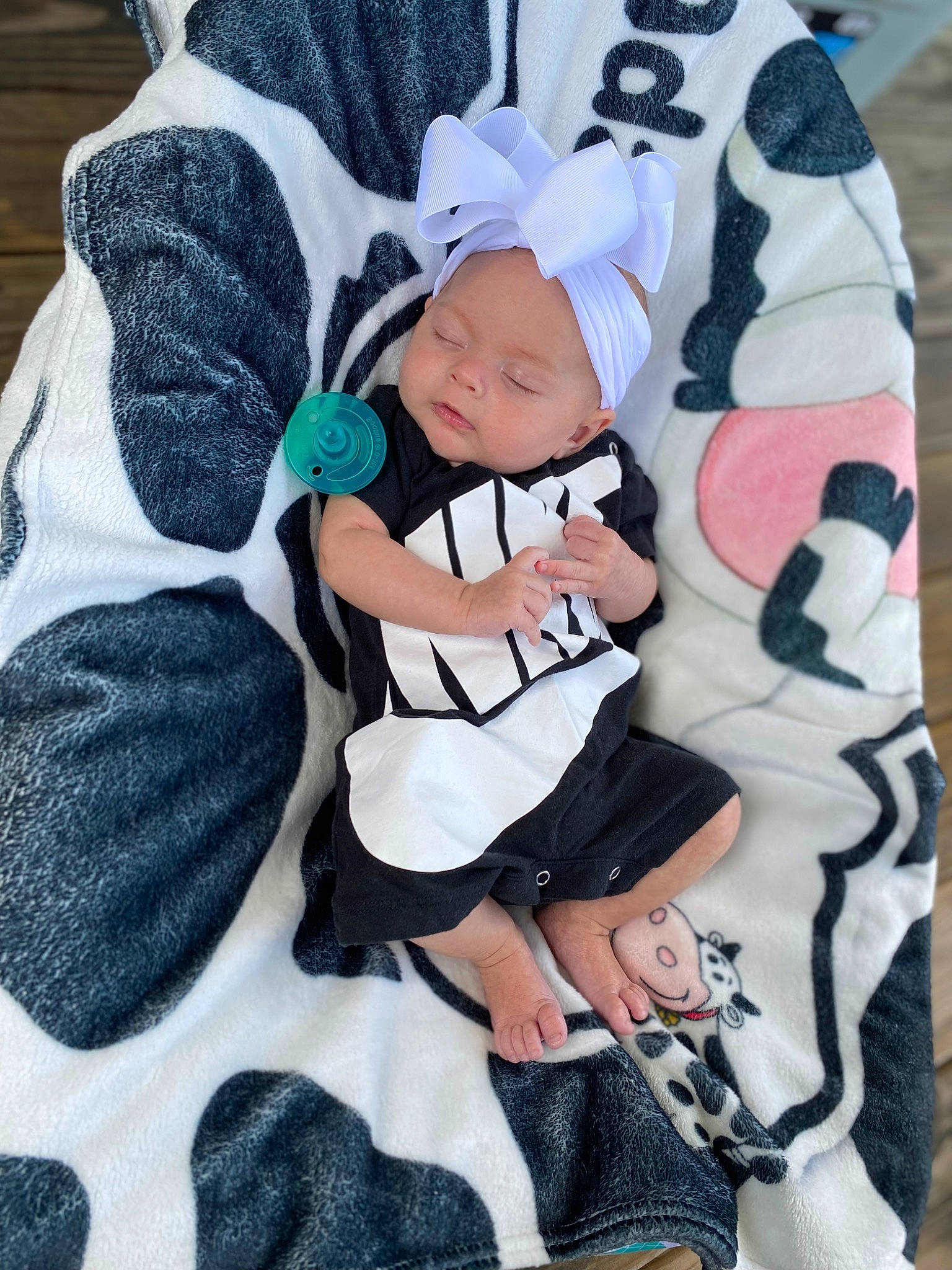 Adalynn is registered to the contest to win money with this photo: baby, baby_products, baby_toddler_clothing, beanie, cap, child, comfort, costume_hat, happy, hat, headwear, linens, pattern, person, sitting, sleeve, sock, textile, thigh, toddler