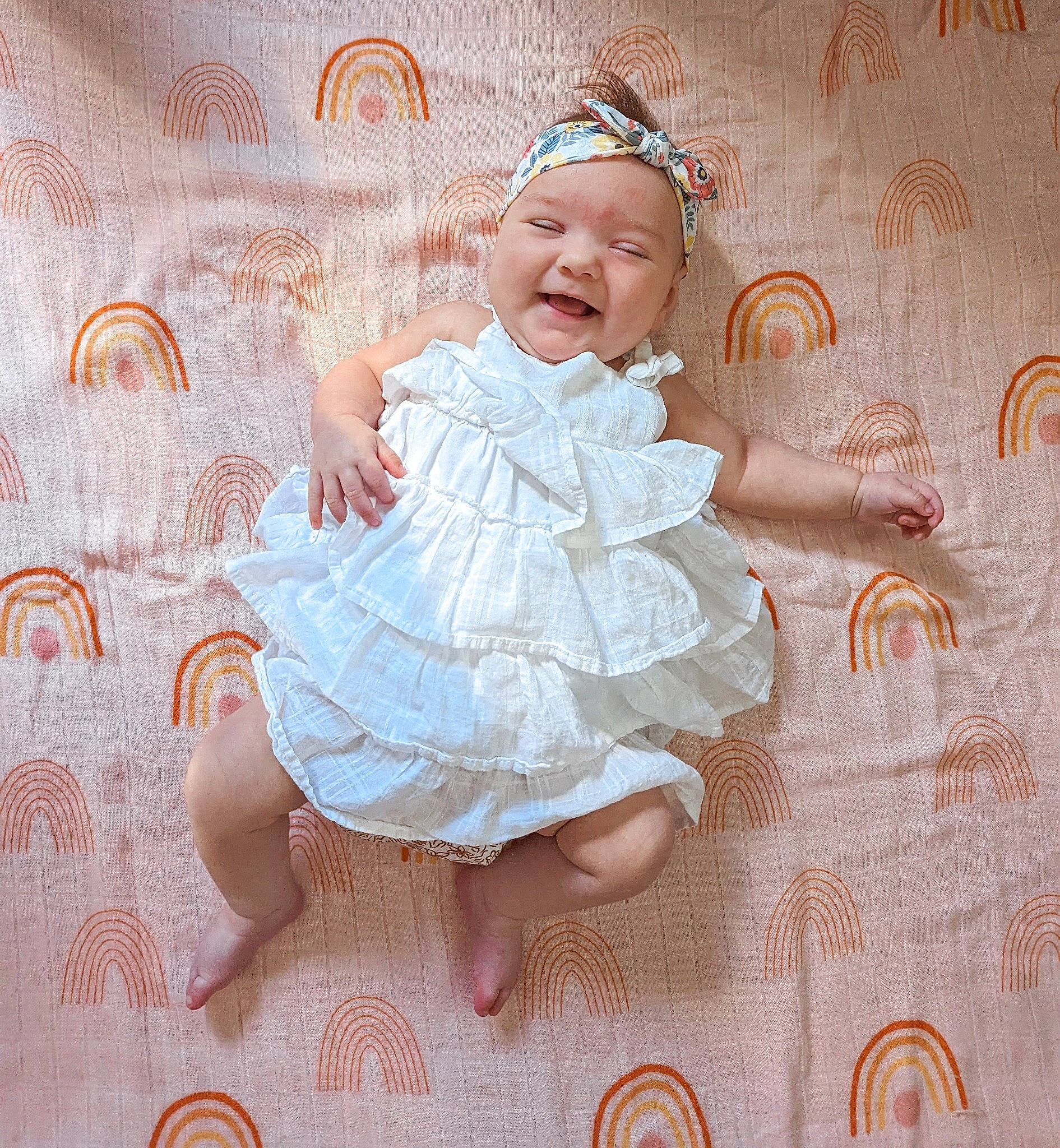 Leona is registered to the contest to win money with this photo: art, baby, baby_products, baby_toddler_clothing, child, costume, creative_arts, day_dress, dress, embellishment, happy, headpiece, headwear, pattern, peach, person, pink, ruffle, smile, textile