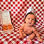 baby, infant, donuts, krispy_kreme, paper_hat, red_and_white_checkered, blanket, food, box, celebration, half_birthday, cute, chubby, sitting, curly_hair, skin, expression, indoor, portrait, milestone