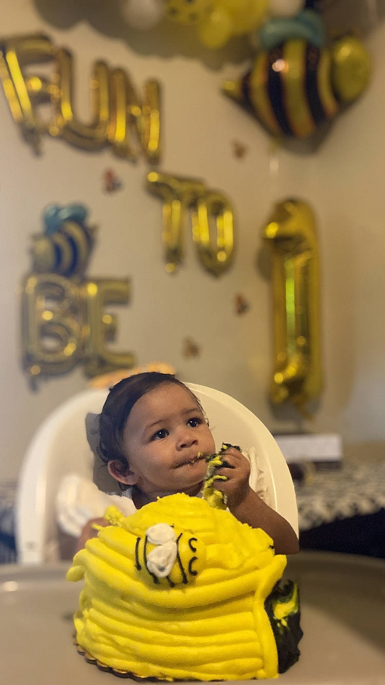 Amya is registered to the contest to win money with this photo: baby, cheek, child, comfort, event, fun, green, happy, leisure, metal, person, photograph, photography, picture_frame, room, sitting, snapshot, toddler, tradition, vacation