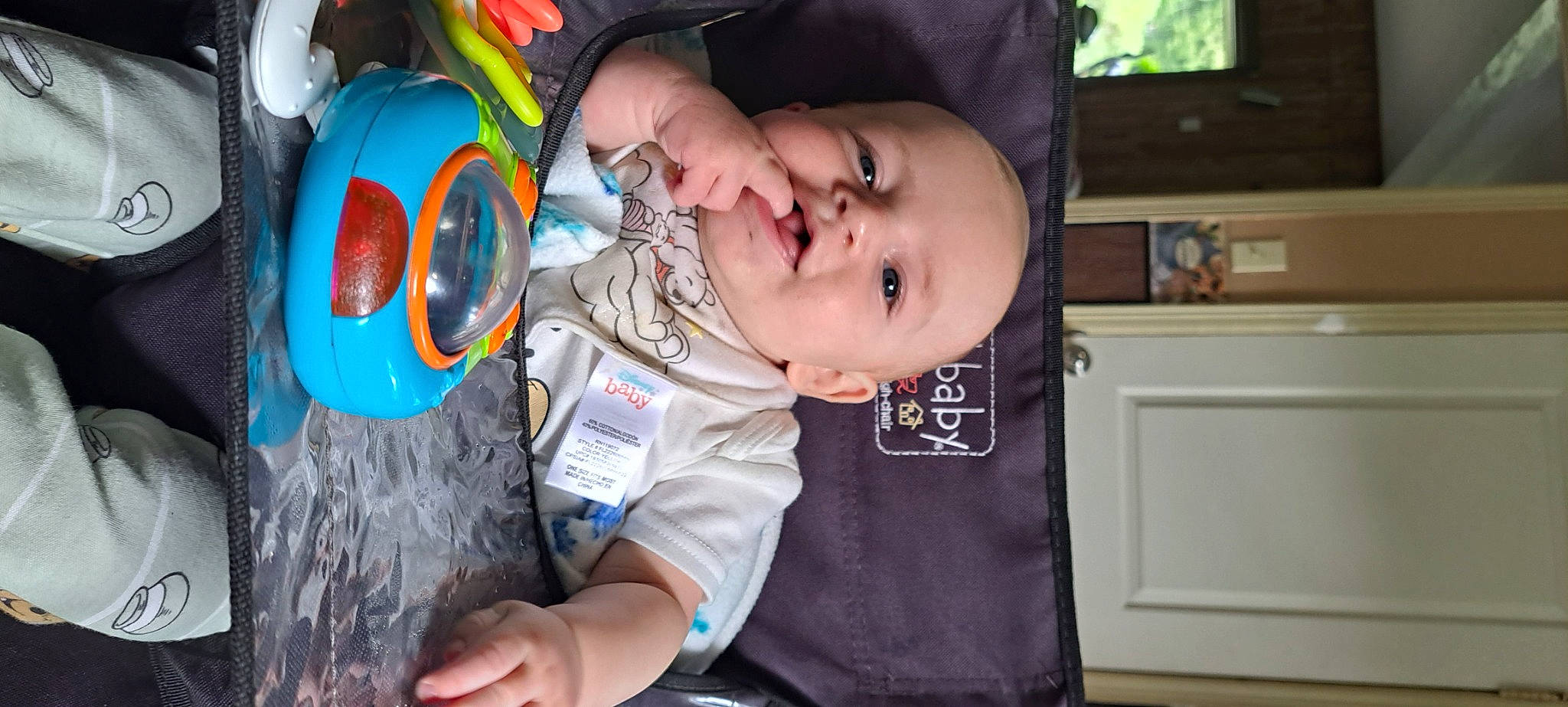 Dennis joined the competition — help win amazing prizes! baby, baby_products, baby_toddler_clothing, cheek, child, fun, happy, hat, iris, kitchen_appliance, mouth, nose, person, personal_protective_equipment, shelf, sitting, smile, t_shirt, television, toddler