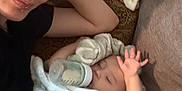 Alejandro joined the competition — help win amazing prizes! baby, bottle, blanket, child, cozy, couch, face, female, furniture, infant, laying_down, person, portrait, resting, sleeping, soft_texture, toddler, young_adult, indoor, casual