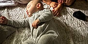 Alejandro is registered to the contest to win money with this photo: baby, bed, blanket, child, clothing, comfort, cozy, cute, fabric, indoor, infant, nap, peaceful, pillow, resting, room, sleeping, soft_lighting, teddy_bear, two_children