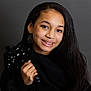 adult, blackhair, bodypart, clothing, dimples, face, female, finger, hair, hand, happy, head, longsleeve, mouth, person, photography, portrait, sleeve, smile, woman