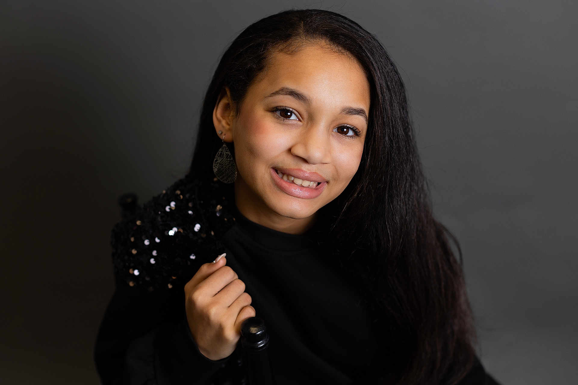 Brielle is registered to the contest to win money with this photo: adult, blackhair, bodypart, clothing, dimples, face, female, finger, hair, hand, happy, head, longsleeve, mouth, person, photography, portrait, sleeve, smile, woman